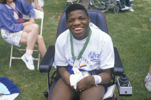 a special child in a wheelchair smiling